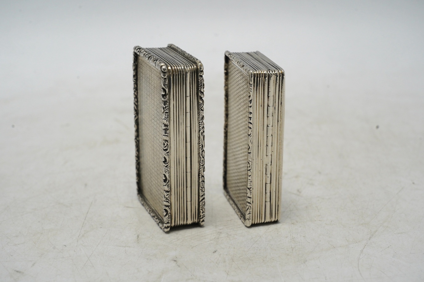 Two late William IV engine turned silver rectangular snuff boxes, Francis Clark, Birmingham, 1835/6, largest 70mm. Condition - fair